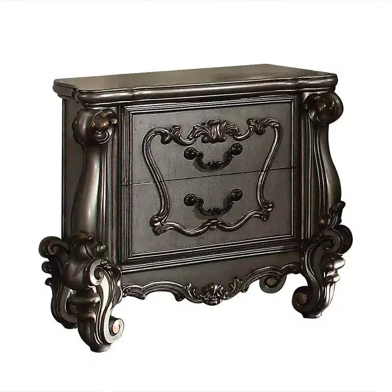 Comodino antico in platino con intagli ornamentali e vani multi-cassetto